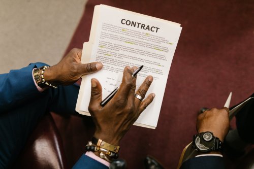 man holding contract