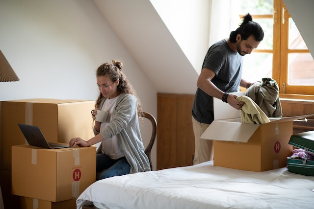 two people unboxing in a new home